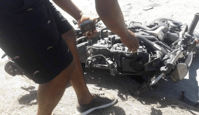 Motorcyclist dies after slamming into woman and utility pole