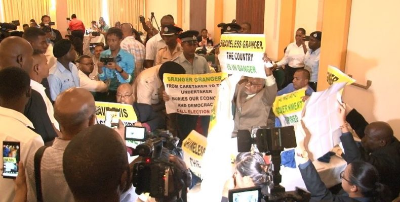 PPP protestors inside Pegasus Hotel hid placards from security