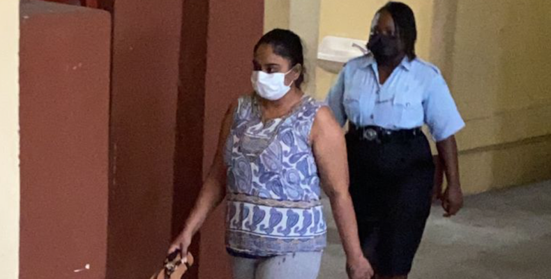 Wife of accused Ponzi scheme operator charged for allegedly forging COVID test results