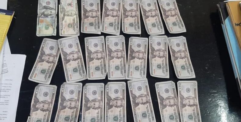 Triumph men caught with counterfeit US money