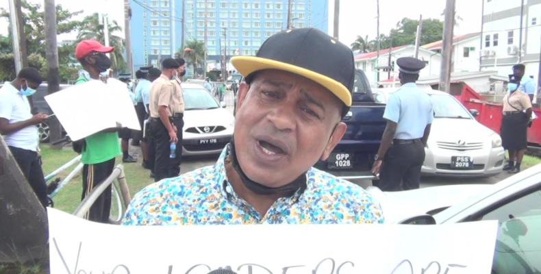 Glenn Lall takes protest for renegotiation of Oil contracts to Energy Conference