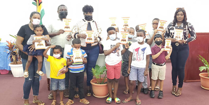US-based Guyanese author donates children’s book to National Library